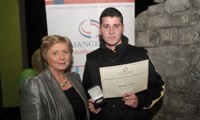 Michael Collins receives his Award from Minister Fitzgerald