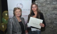 Angela McDonagh receives her Award from Minister Fitzgerald